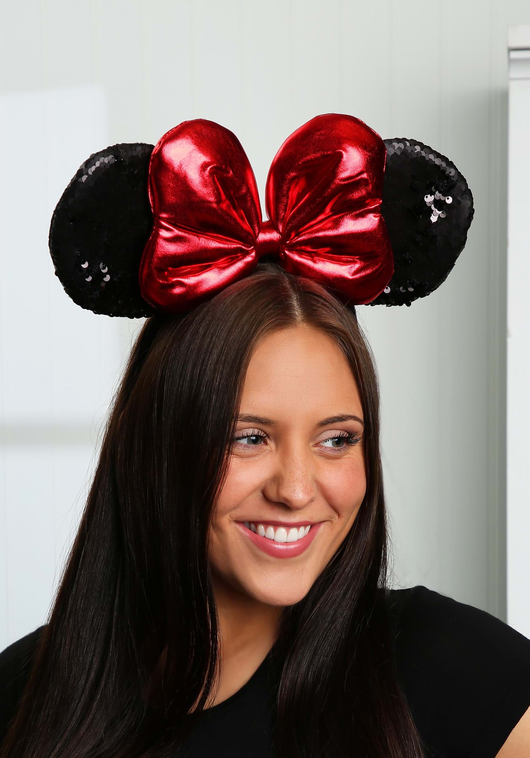 A pink sequin Minnie ears costume headband photographed for a US costume retailer listing